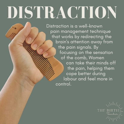 Hand holding a wooden birth comb with text about distraction as a pain management technique on a gray background.