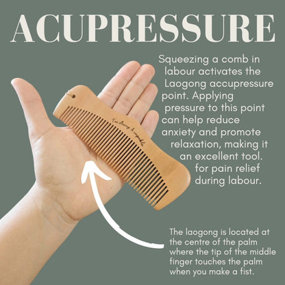 Wooden birth comb held in a hand with text explaining acupressure benefits on a green background